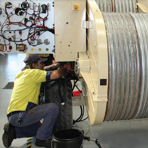 Image of worker refurbishing Tesmec machine